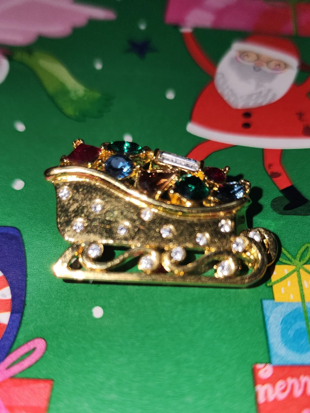 Monet Gold-tone Festive Sleigh Brooch with Multicolor Rhinestones